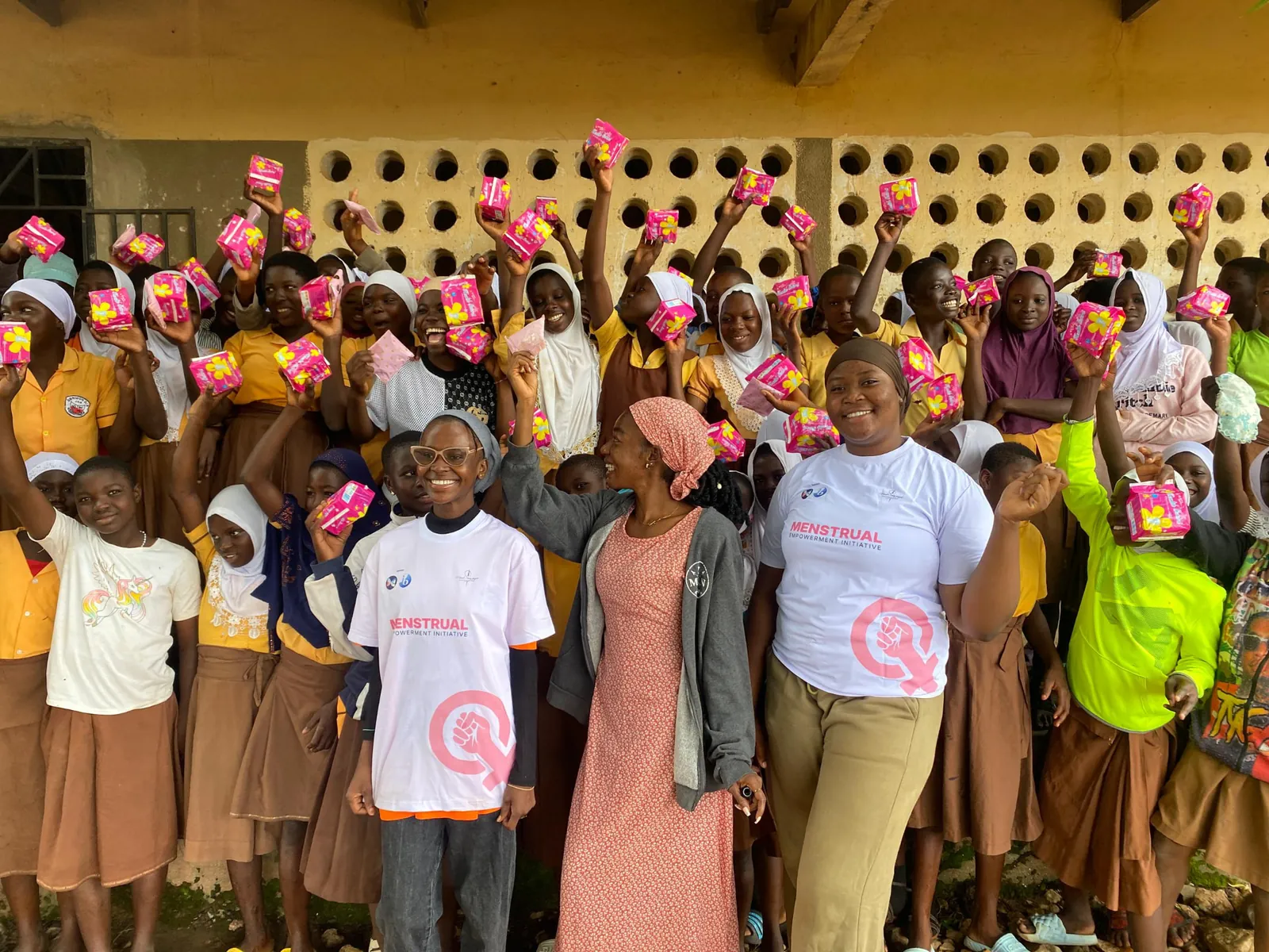 Girls in Upper West Ghana celebrating with menstrual pads received from the MEI team